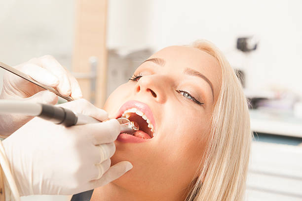 istock Dentist and a female patient 614608230