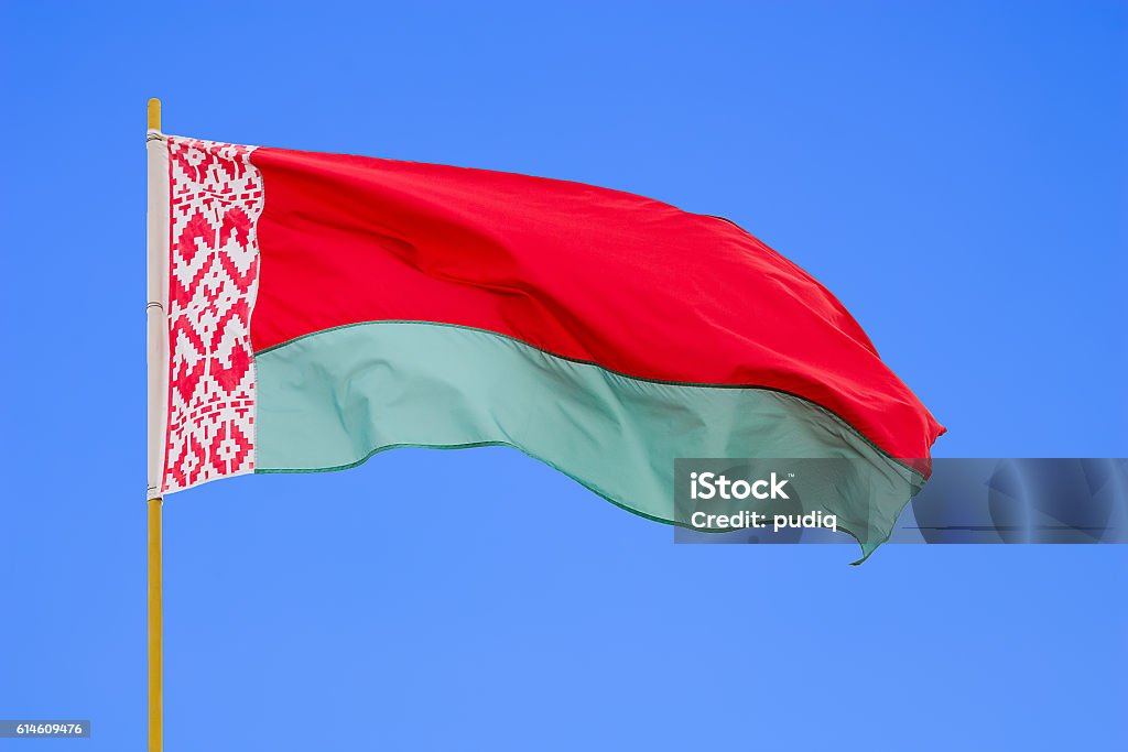 Belarus flag Belarus flag is waving in front of blue sky Belarus Stock Photo