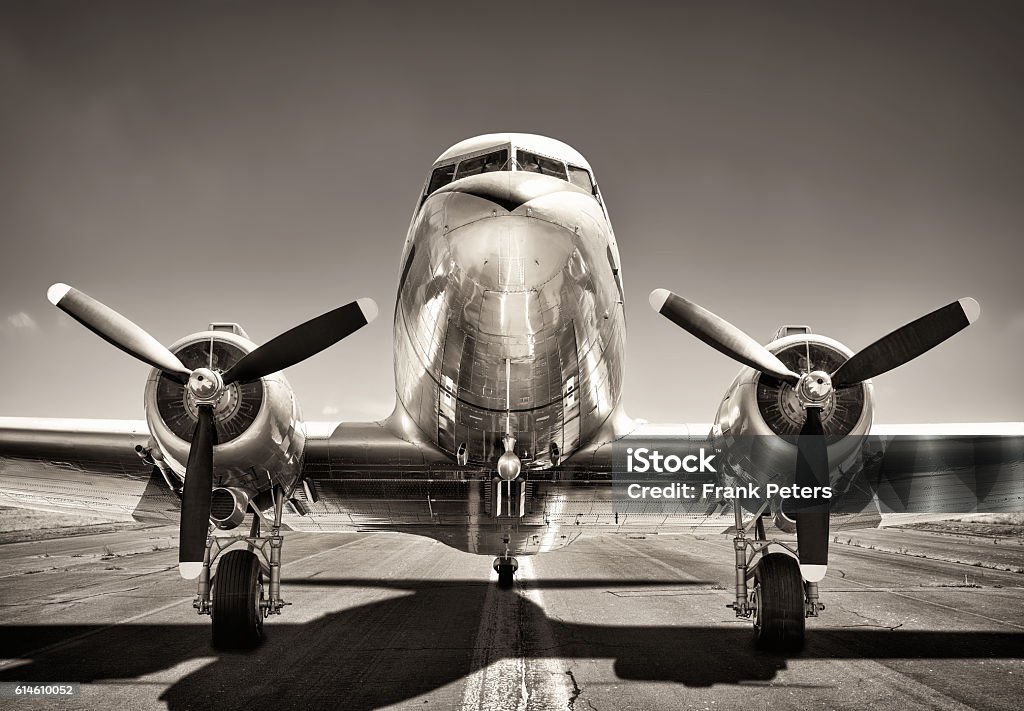 vintage airplane airplane on a runway Airplane Stock Photo