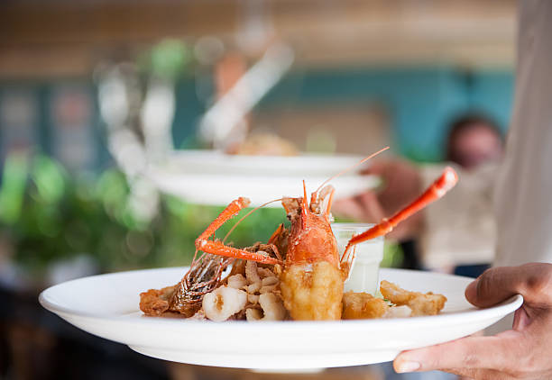 istock Waiter serving delicious food 614610244