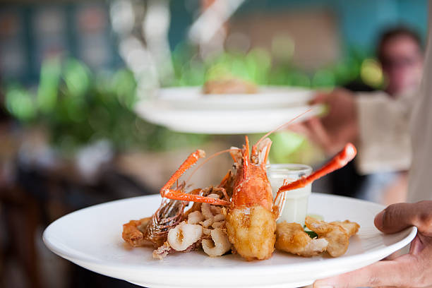 istock Waiter serving delicious food 614610364