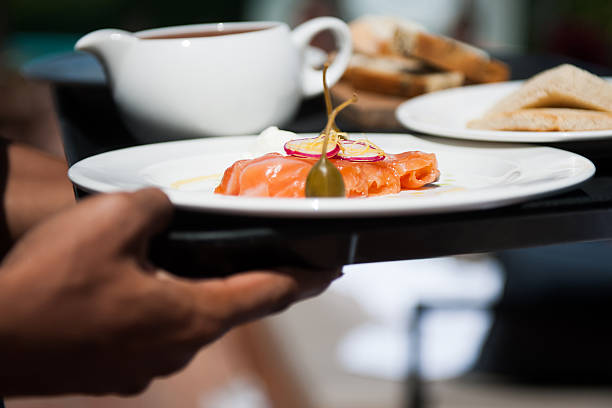 istock Waiter serving delicious food 614611988