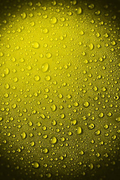 istock Yellow glass with water drops 614612044