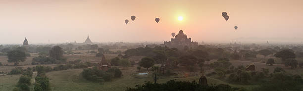 istock Hot air balloon over plain of Bagan in misty morning 614616172