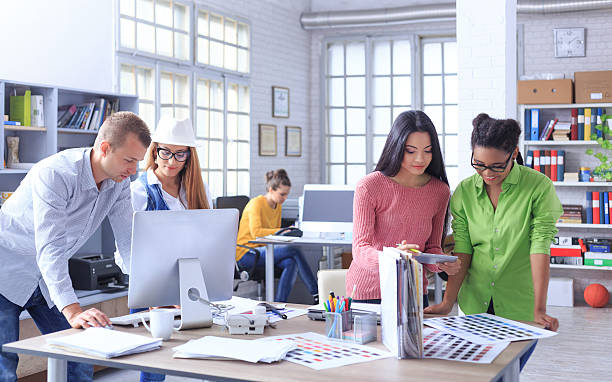 istock Team of young people working at workplace 614616832