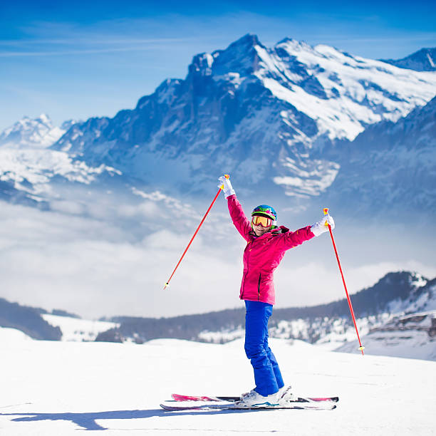 istock Young active woman skiing in the mountains. 614617336