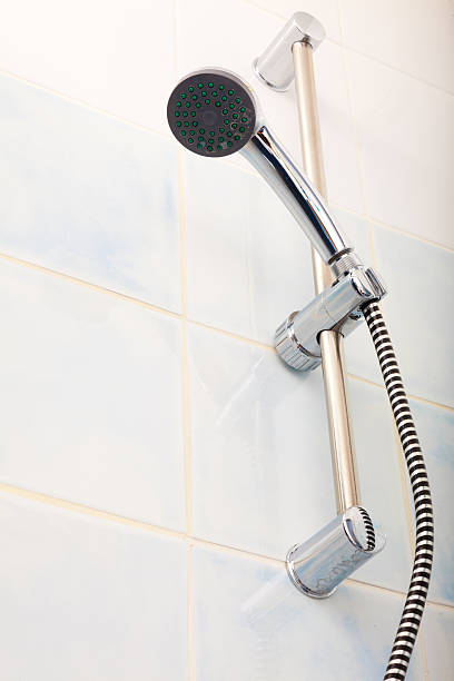 istock Closeup of shower head in bathroom. 614618794