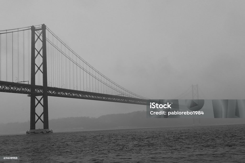 Fog on the Bridge 25 April, Lisbon 25 de Abril Bridge, Lisbon on a foggy day 2015 Stock Photo
