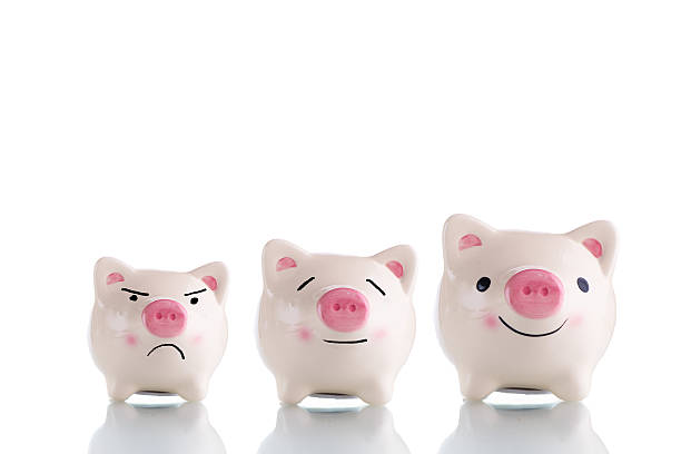 istock Three white piggy bank with different size and emotion 614619034