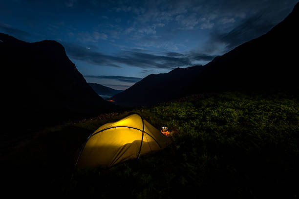 istock Night in a tent pitched in Glen Coe, Scotland 614621710