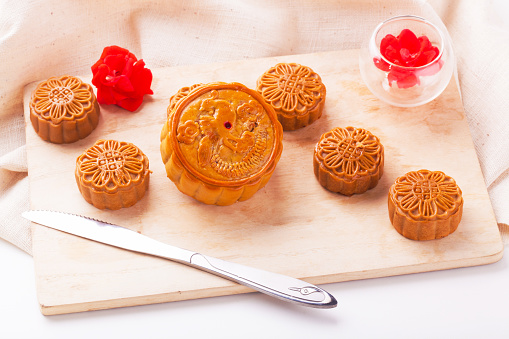 Chinese mid-Autumn Festival. Traditional mooncake on table setting.