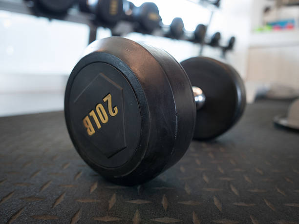 istock dumbbell onthe ground in gym 614622738