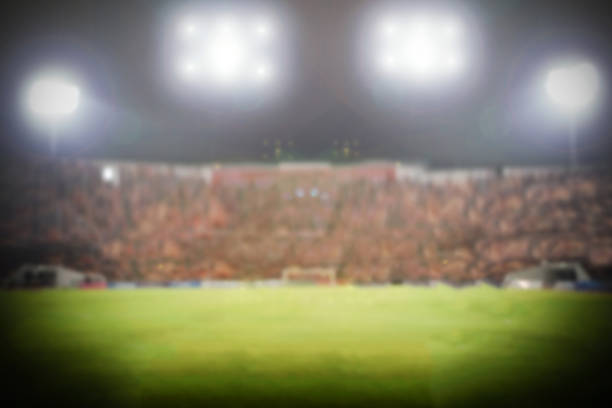 istock blurry of football stadium for background 614626270