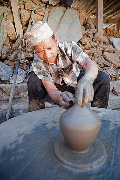 istock Pottery making on potters square, Bhaktapur, Nepal 614628332
