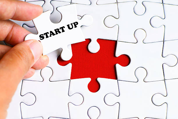 istock Puzzle with a hand hold a piece of 