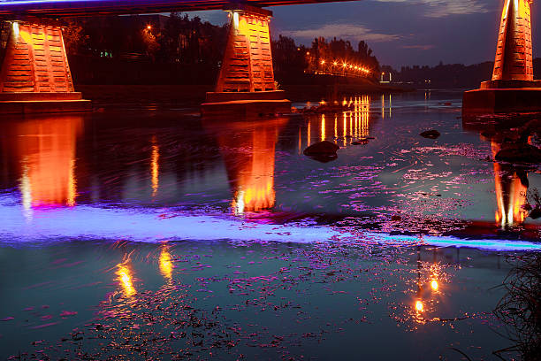 istock reflection in the water of illumination the bridge 614628644