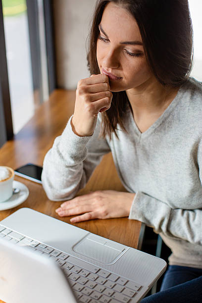 istock Beautiful woman working on a coffee break 614628954