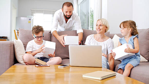 istock Family at home playing with virtual reality headsets. VR. 614630620