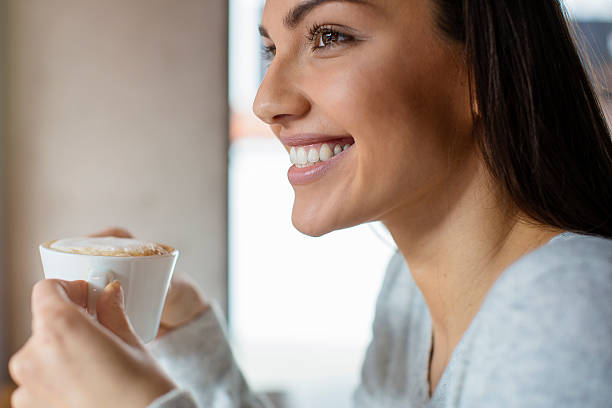 istock Pretty woman drinking coffee 614631758