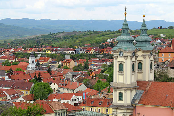 churches buildings and houses on hills Eger cityscape Hungary stock photo