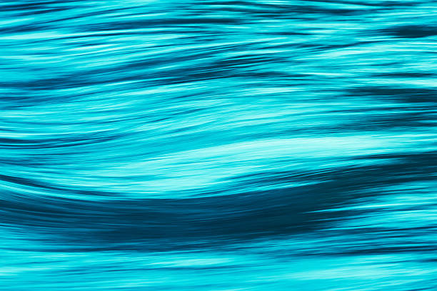 istock seven color long exposure water wave, cyan 614633864