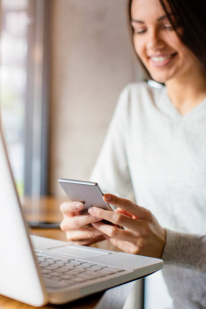 istock Young woman looking at her phone 614633888