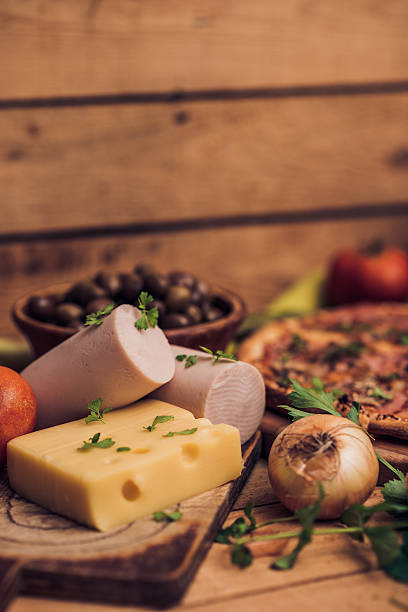 Rustic Pizza on Wooden Table with Food Ingredients
