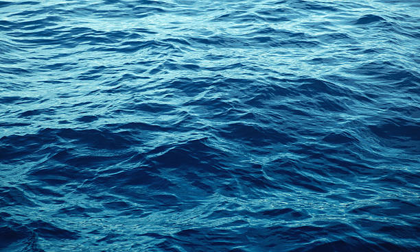 istock Blue sea with waves close up 614635098