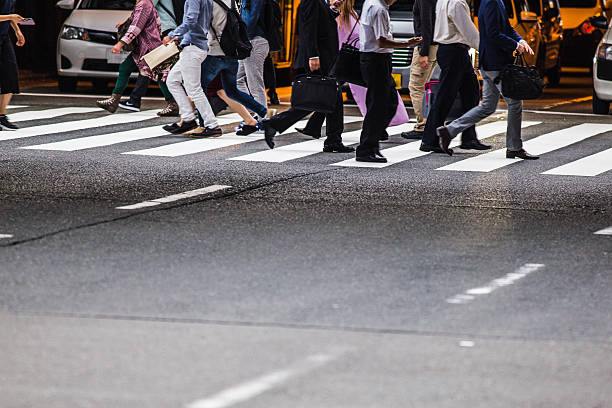istock Asian People are across the crosswalk 614637126