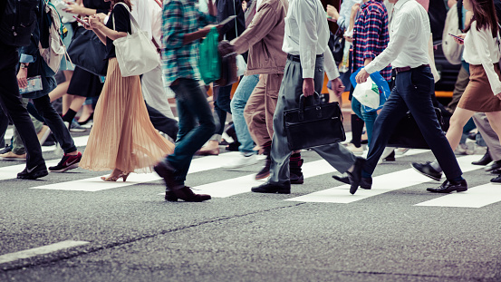 Asian People are across the crosswalk