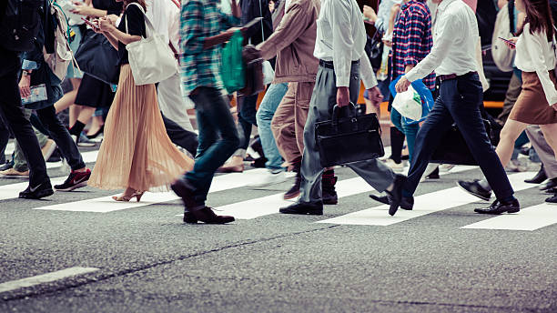 asian people are across the crosswalk - osaka prefecture imagens e fotografias de stock