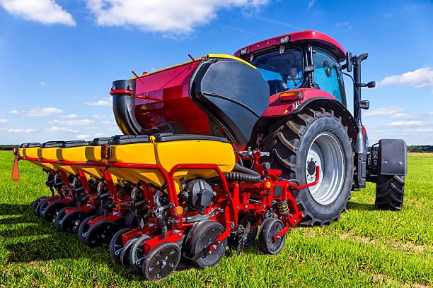 istock Tractor with seeding and plowing machine on the plantation 614638518