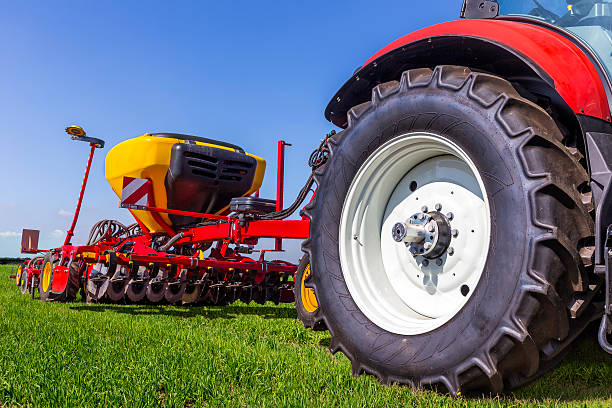 istock Tractor with seeding and plowing machine on the plantation 614638620