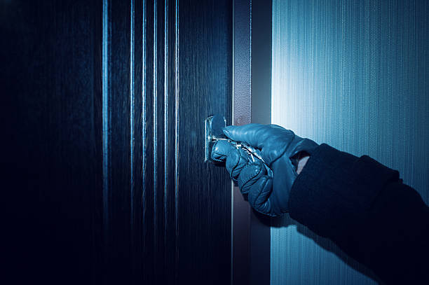 istock man in gloves opens the door Close up 614640148