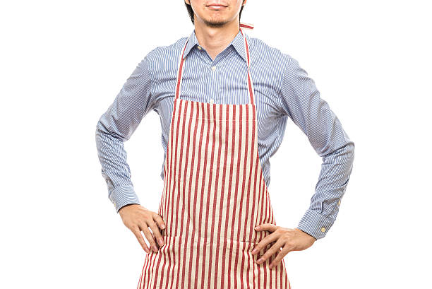 istock Businessman wearing an apron 614644102