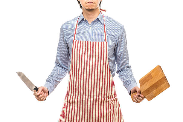 istock Businessman wearing an apron 614644232