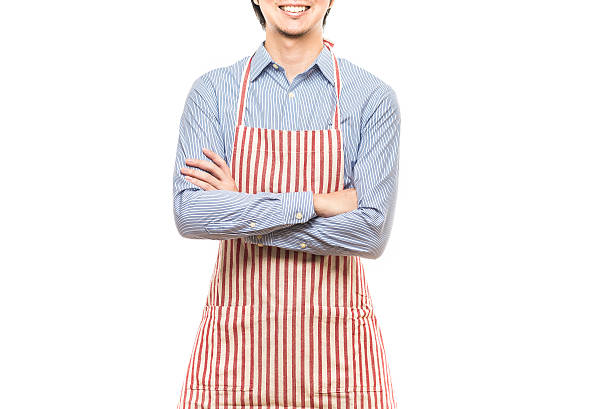 istock Businessman wearing an apron 614644294