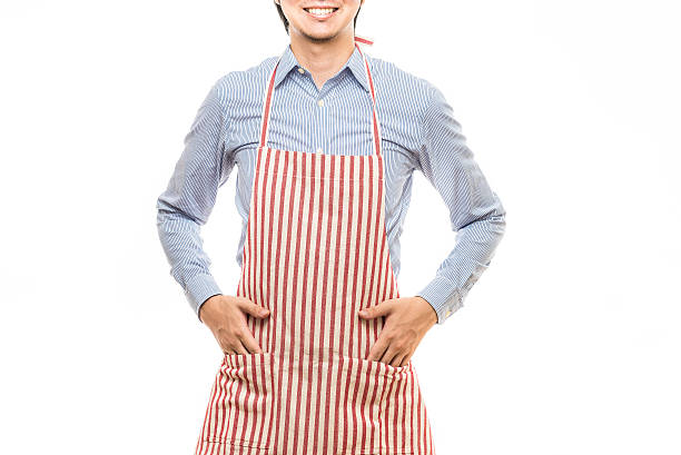 istock Businessman wearing an apron 614644336