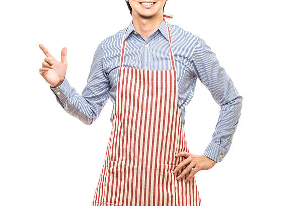 istock Businessman wearing an apron 614644420