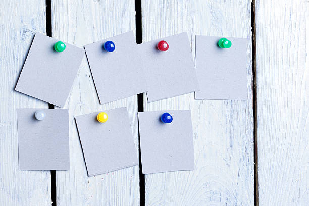 istock blank sheets of paper pinned colored buttons 614646184