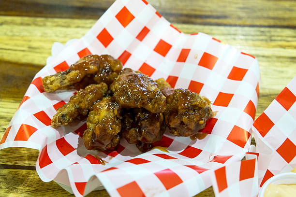 istock Chicken wings with Honey BBQ sauce 614646738
