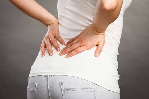 istock Woman suffering from back pain 614646870