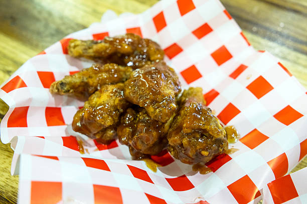 istock Chicken wings with Honey BBQ sauce 614646994