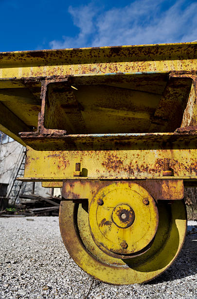 istock Old yellow vintage cart with a blue sky 614647512