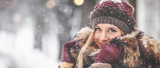 istock Portrait of beautiful girl outdoors while showing 614648536