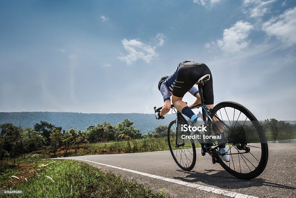 Men cycling road bike in the morning Adult Stock Photo