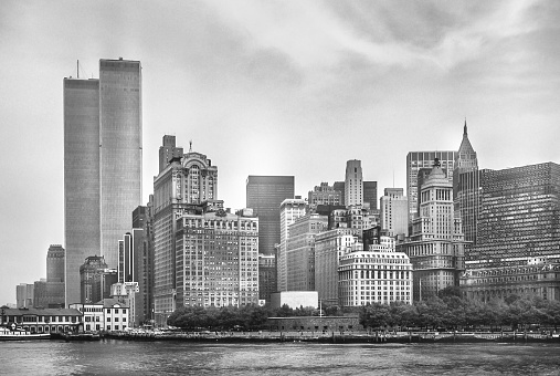 New York City skyline from NJ with World Trade Center featured as landmark of Twin Towers. Lower Manhattan in NYC, United States. Black and white background.