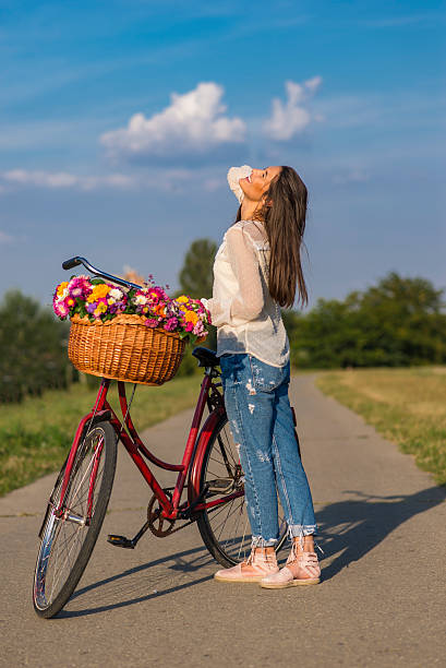 istock Young woman on bicycle 614650636