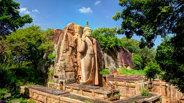 Avukana Buddha image Colossal Statue of Avukana Buddha image, Sri Lanka anuradhapura stock pictures, royalty-free photos & images