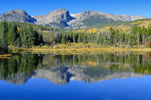 istock Mountains and alpine lake with reflection in the fall 614702882